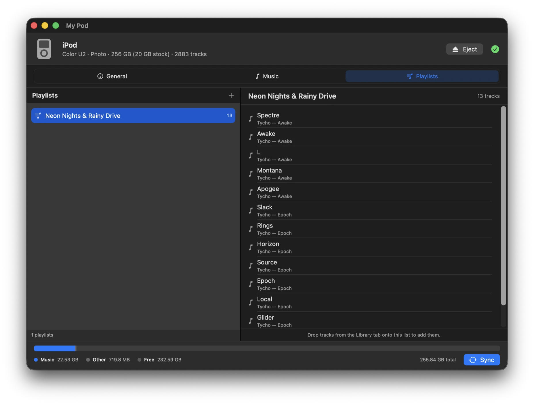 The Playlists tab: a list of playlists on the left, and the selected playlist's 13 tracks on the right with title, artist and album for each.
